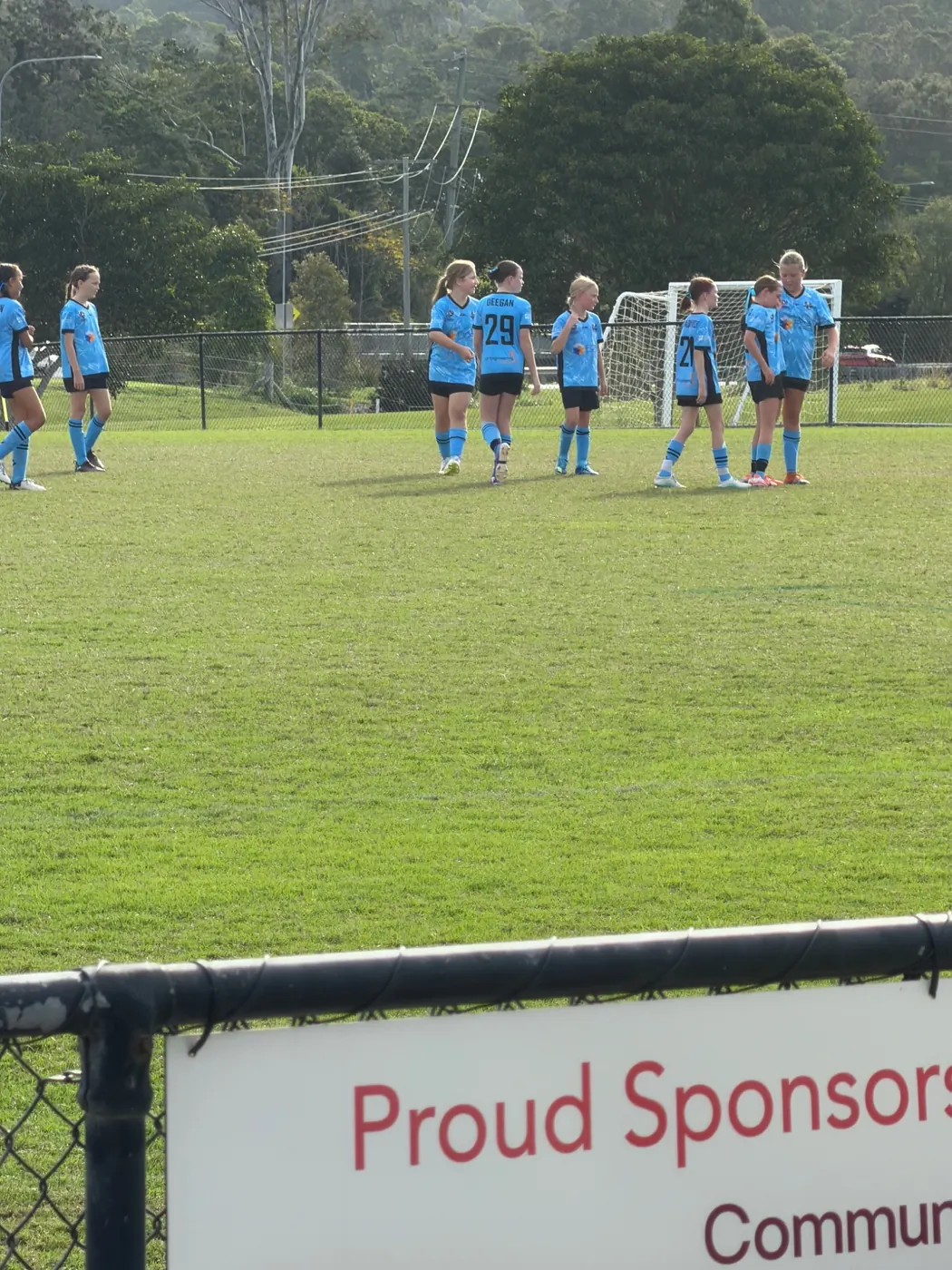Chloe with her soccer team on the field