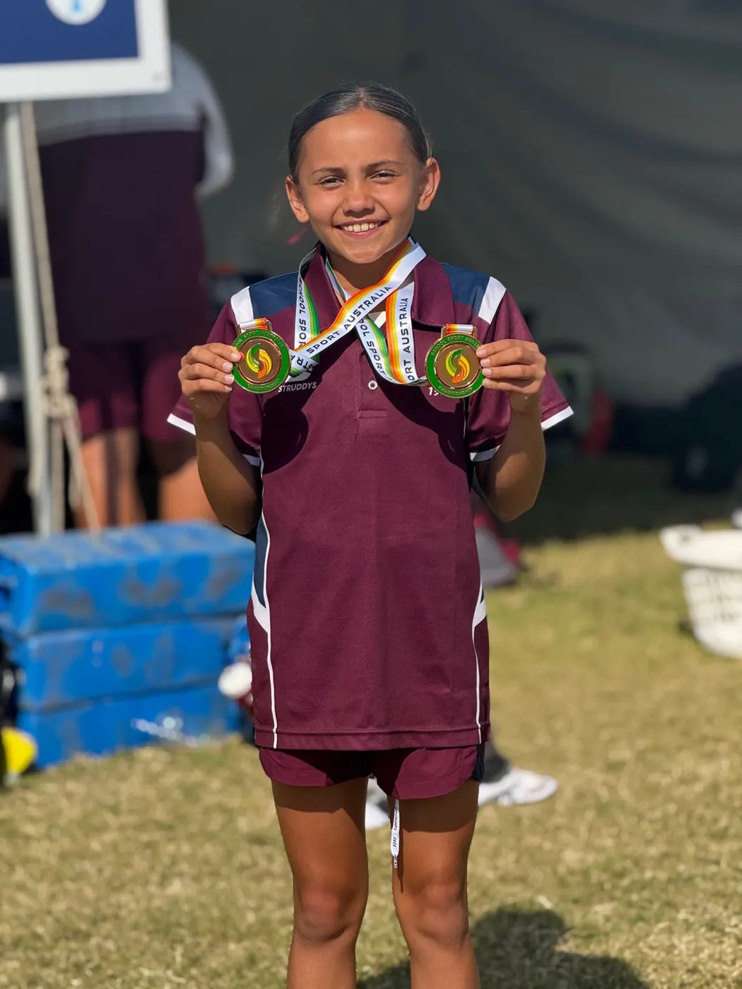Chloe Edgtton representing Queensland Maroon with medals